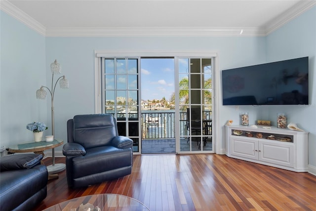 living room with ornamental molding and wood finished floors