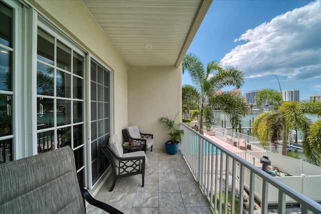 balcony featuring a water view