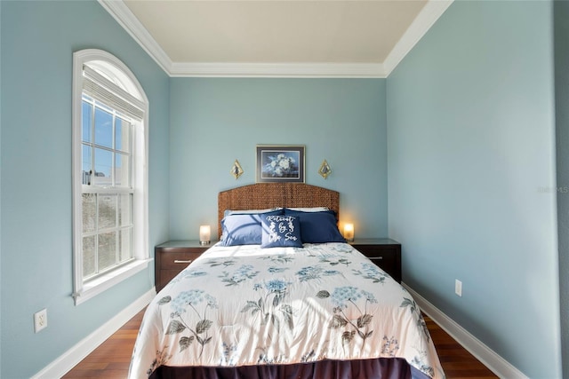 bedroom featuring dark wood-style floors, crown molding, and baseboards