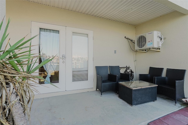 view of patio / terrace featuring french doors, ac unit, and outdoor lounge area