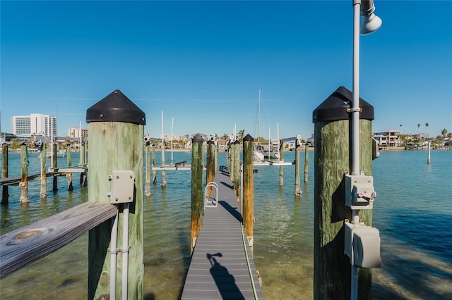 view of dock featuring a water view and boat lift