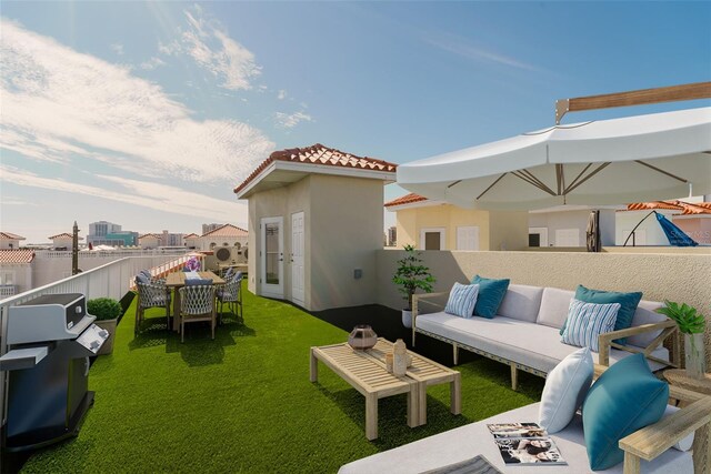 view of patio / terrace featuring grilling area, fence, and outdoor lounge area