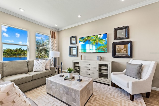 living room with a water view, crown molding, and light parquet flooring