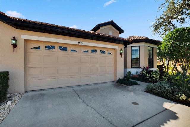 mediterranean / spanish-style house featuring a garage