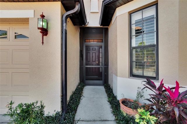 property entrance with a garage