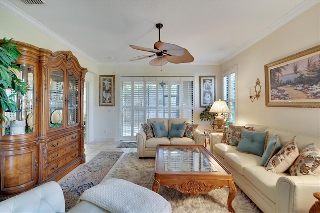 living room with light tile patterned floors, ceiling fan, and ornamental molding