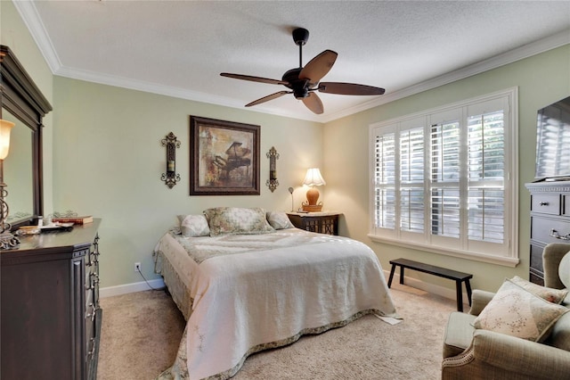 carpeted bedroom featuring a textured ceiling, ceiling fan, and ornamental molding