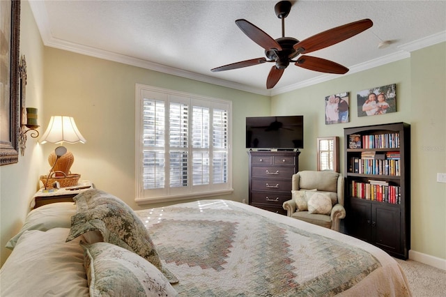 carpeted bedroom with a textured ceiling, ceiling fan, and crown molding