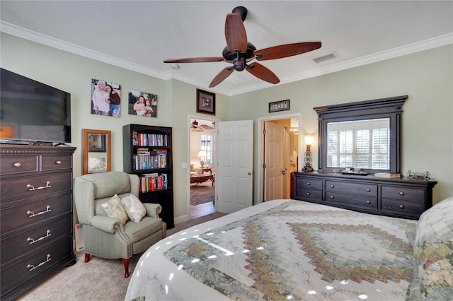 bedroom featuring ceiling fan, crown molding, and light carpet