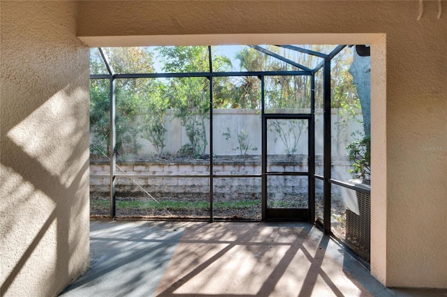 unfurnished sunroom featuring a wealth of natural light