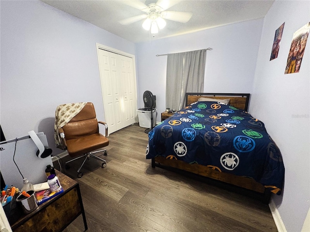 bedroom with hardwood / wood-style floors, a closet, and ceiling fan