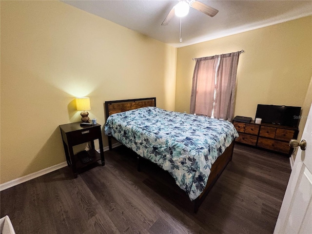 bedroom featuring ceiling fan and dark wood-type flooring