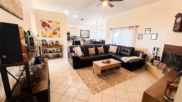 living room featuring ceiling fan and light tile patterned flooring