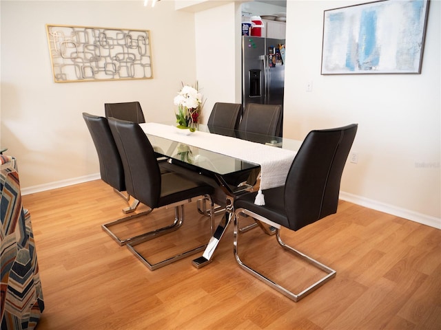 dining room with hardwood / wood-style flooring