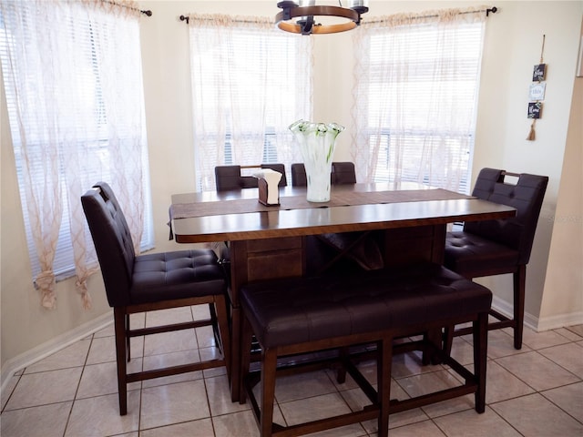 dining area with light tile patterned floors