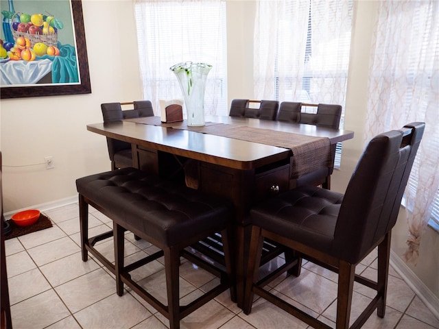 dining area with light tile patterned floors