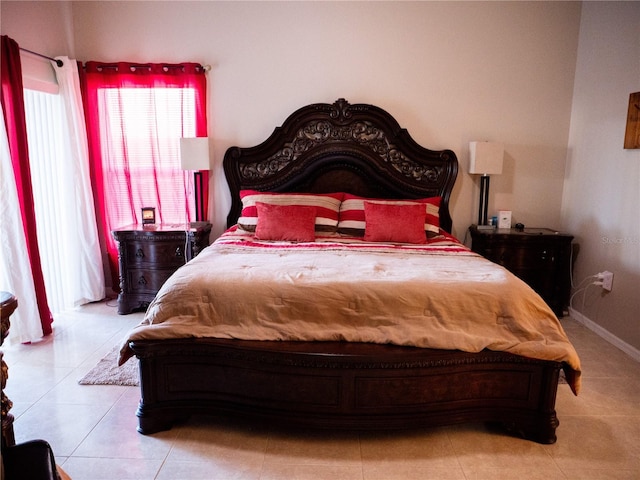 bedroom with light tile patterned floors