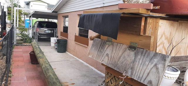 exterior space featuring a carport