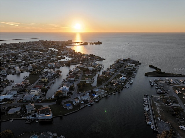 aerial view at dusk with a water view