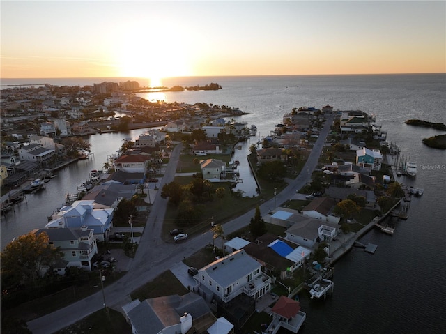 aerial view at dusk with a water view