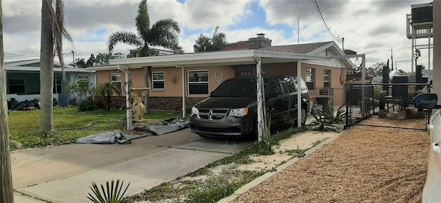 view of front of home with a carport