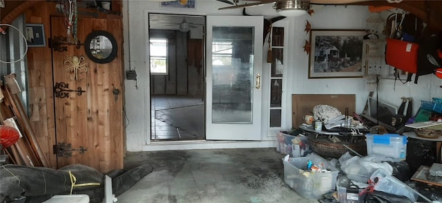 misc room featuring concrete floors and ceiling fan