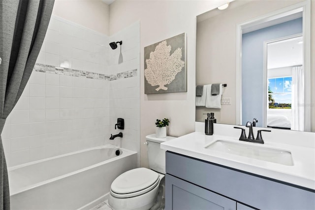 full bathroom with vanity, shower / bath combination with curtain, and toilet