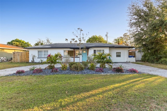 ranch-style home with a front yard