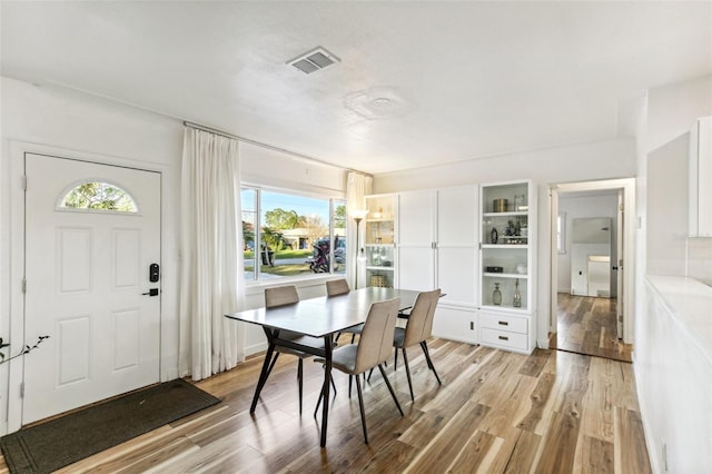 dining room with light wood-type flooring