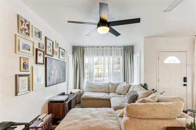 living room featuring ceiling fan