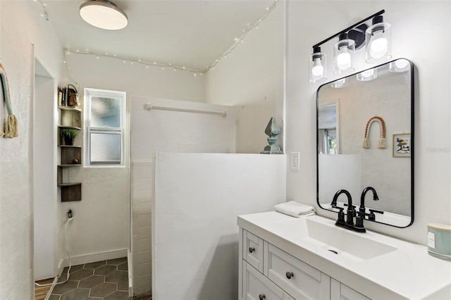 bathroom featuring tile patterned floors and vanity