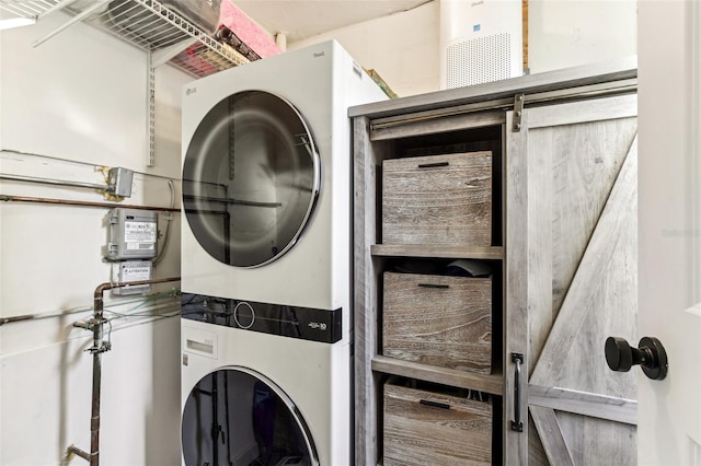 laundry area featuring stacked washer / dryer