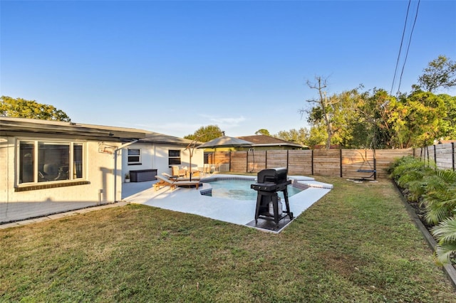 view of yard featuring a fenced in pool and a patio