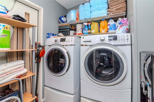 washroom featuring washer and dryer