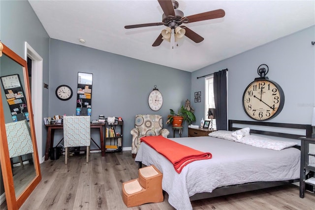 bedroom featuring hardwood / wood-style flooring and ceiling fan