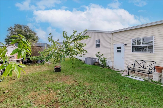 view of yard with central AC