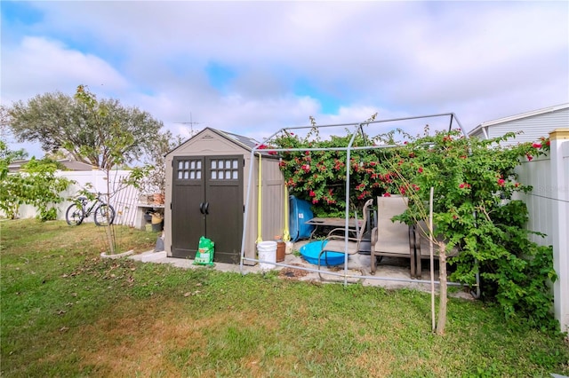 view of outbuilding featuring a lawn