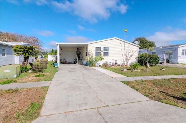 view of front of house featuring a front lawn and a carport