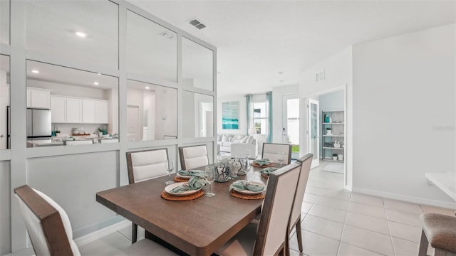 dining area with light tile patterned flooring