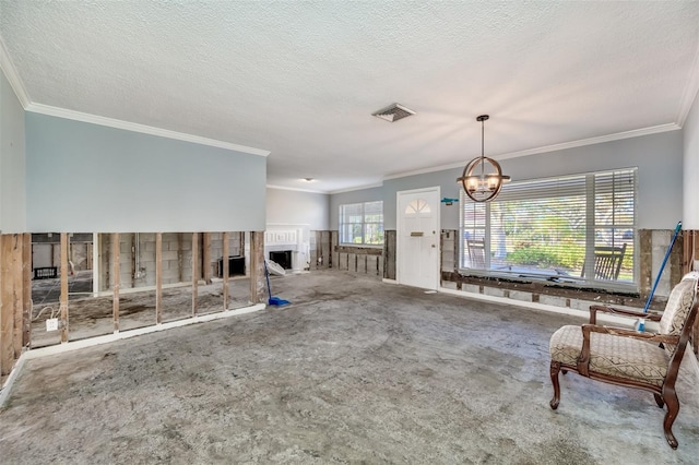 unfurnished living room with carpet floors, a textured ceiling, and ornamental molding