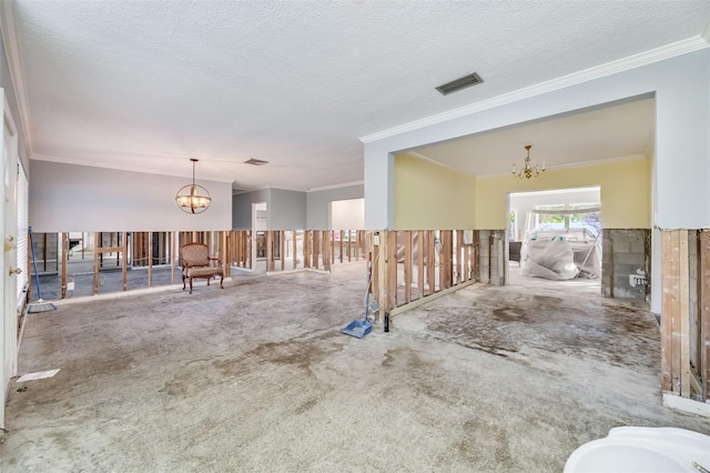 interior space with ornamental molding, a textured ceiling, and a notable chandelier