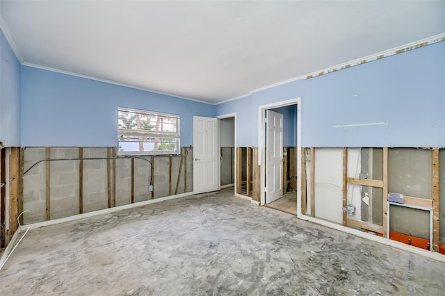 spare room featuring crown molding