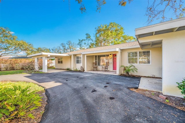 view of front of property featuring a carport