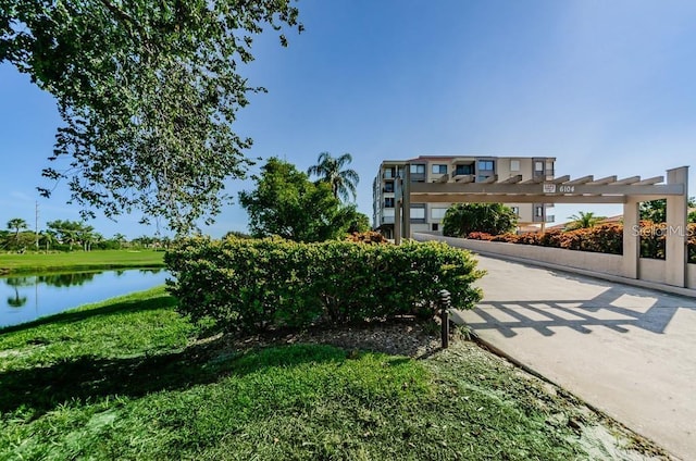 view of home's community with a water view