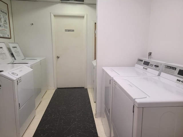 clothes washing area featuring washer and clothes dryer