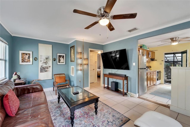 living room featuring ceiling fan, light tile patterned floors, and crown molding