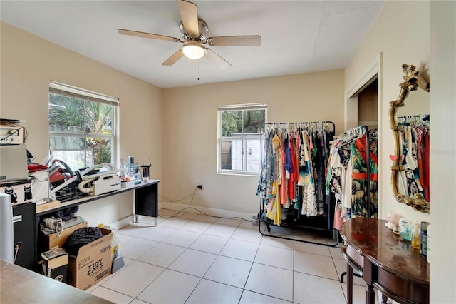 office space with ceiling fan and light tile patterned floors