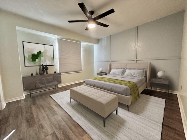 bedroom featuring dark wood-type flooring and ceiling fan