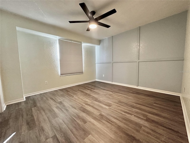 spare room featuring hardwood / wood-style flooring and ceiling fan