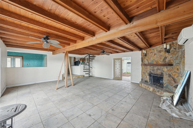 unfurnished living room featuring a fireplace, beam ceiling, ceiling fan, and wood ceiling